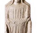 FIGURA KOUROTROPHOS Cipro-arhajsko razdoblje II (oko 600.-480. god. pr. Kr.), vapnenac, dimenzije: vis. 23,6 cm, šir. 13,5 cm, deb. 3,5 cm (DUM AM 472)